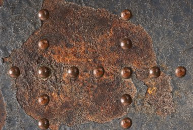Grunge metal texture with rivets clipart