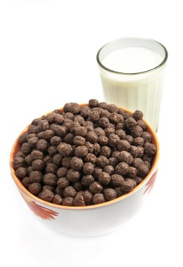 Glass with milk and chokolate balls clipart