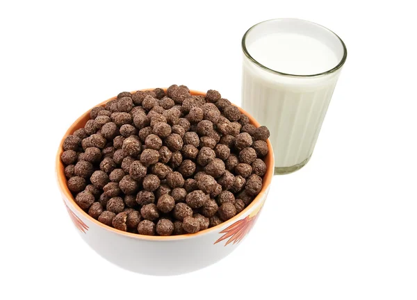 stock image Glass with milk and chokolate balls on t