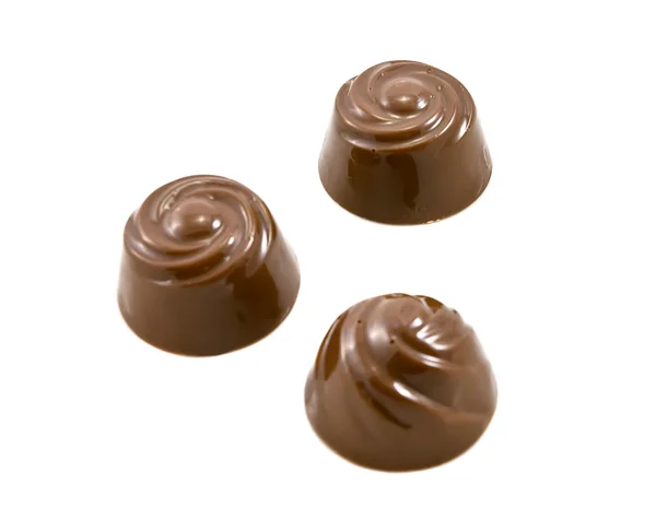 Doces de chocolate no branco — Fotografia de Stock