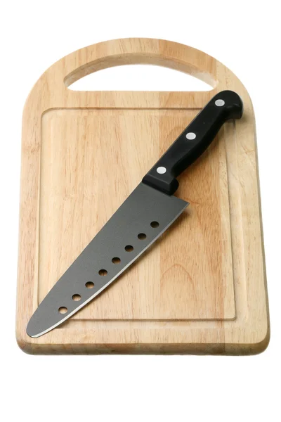 Kitchen knife on a breadboard — Stock Photo, Image