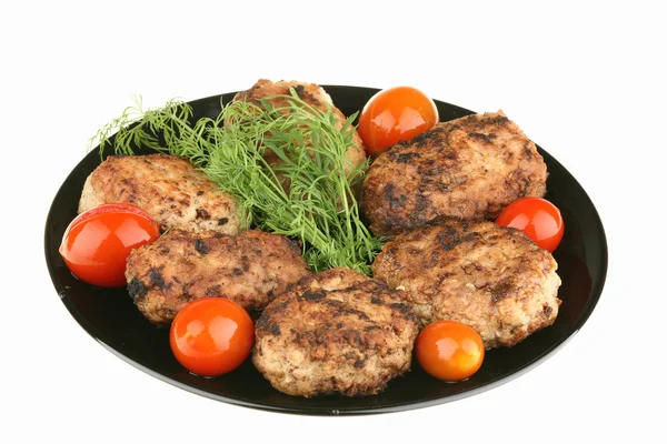 Meat cutlets and red tomatoes — Stock Photo, Image