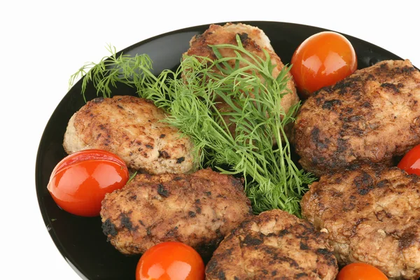 stock image Meat cutlets and red tomatoes