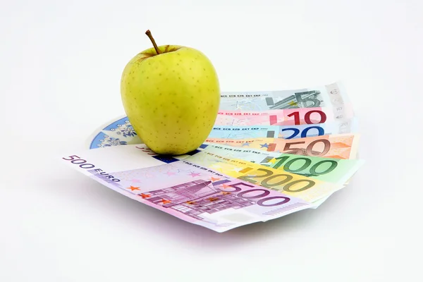 Apple and denominations — Stock Photo, Image