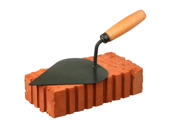 Building trowel and red brick — Stock Photo, Image