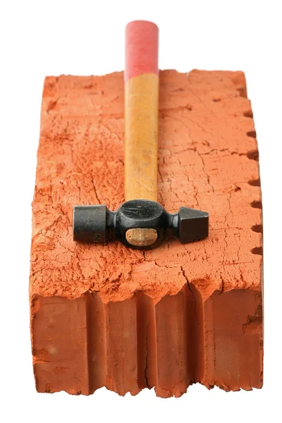 Hammer and red brick — Stock Photo, Image