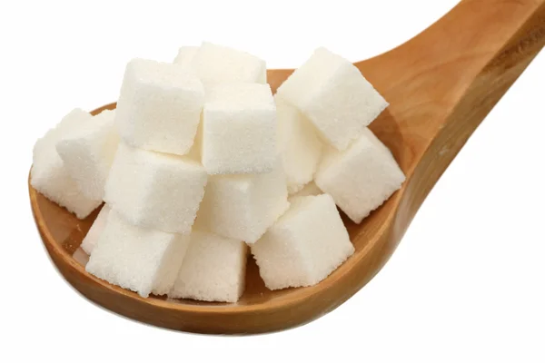 Socker i en träsked — Stockfoto