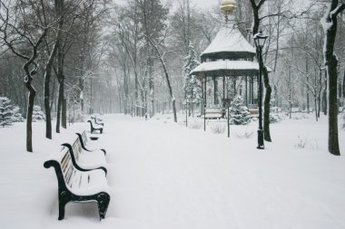 City park with shops in the winter clipart