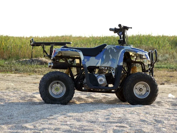 Stock image Small All Terrain Vehicle on a beach