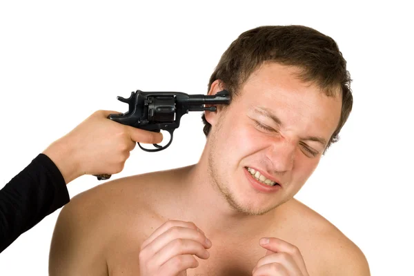 The young man with a pistol at a head. i — Stock Photo, Image
