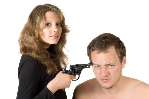 The girl threatens the young man with a — Stock Photo, Image
