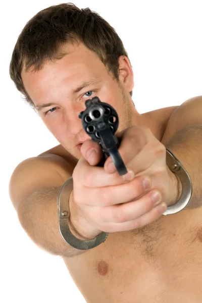 The young man with a pistol. Isolated — Stock Photo, Image