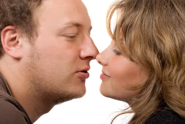 Portrait of young kissing couple. Isolat — Stock Photo, Image