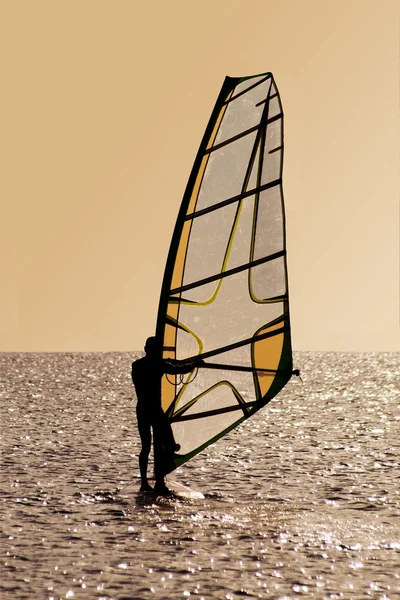Silhouette of a windsurfer on waves — Stock Photo, Image