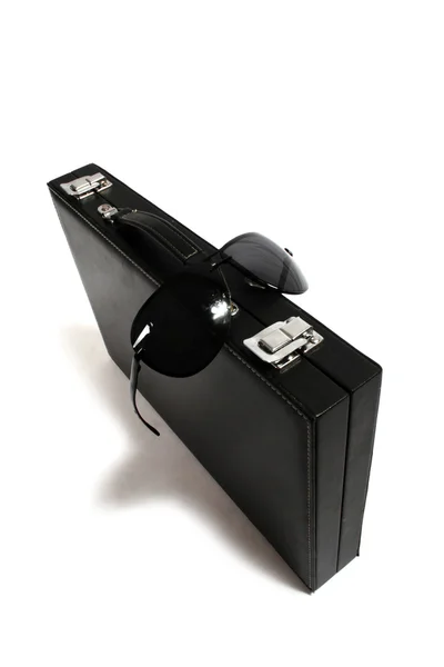 Black suitcase and sunglasses. Isolated — Stock Photo, Image
