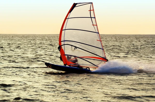Silhouette of a windsurfer on a gulf, mo — Stock Photo, Image