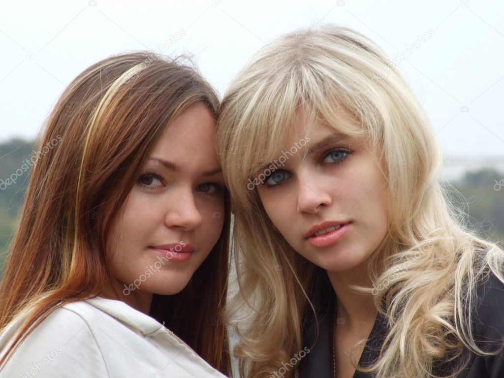 Portrait of two beautiful young girls on