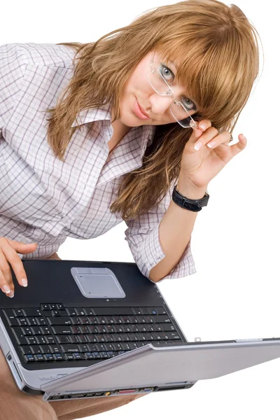 The young woman in glasses sits with the — Stock Photo, Image