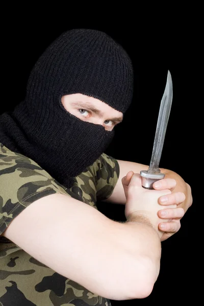 The criminal with a knife in a black mas — Stock Photo, Image