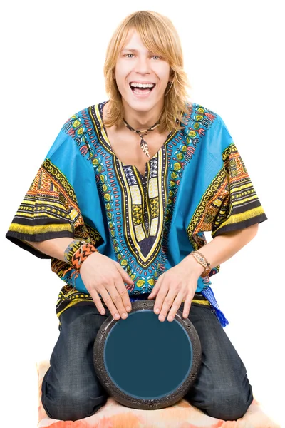 The young man plays a drum over white — Stock Photo, Image