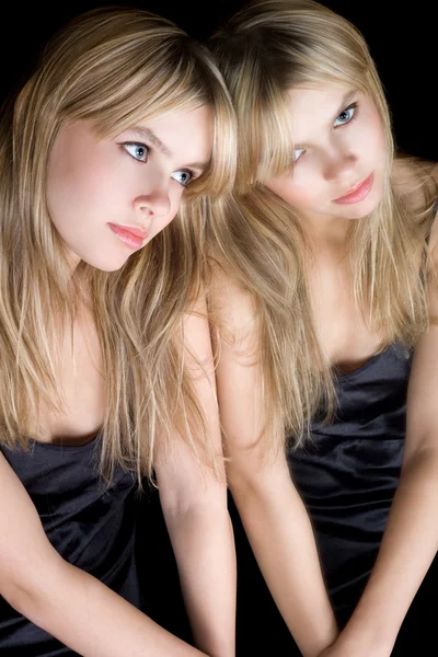 Portrait of the young blonde near a mirr — Stock Photo, Image