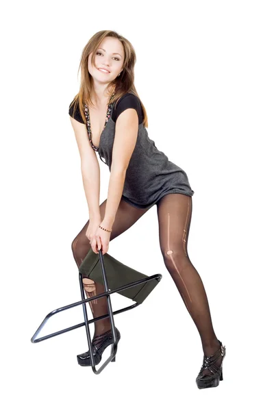 Jovem mulher nas meias rasgadas com um — Fotografia de Stock