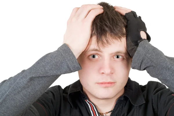 stock image The young man pressure a head. Isolated