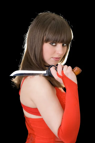 Vacker flicka i rött med en kniv — Stockfoto