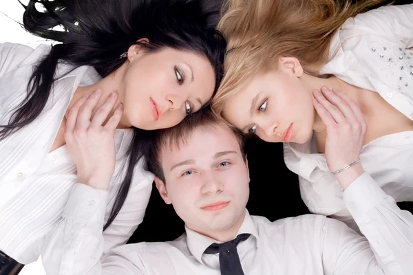 Portrait if the young man and two pretty — Stock Photo, Image