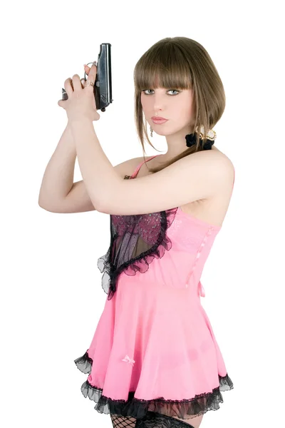 Menina bonita em um vestido rosa com pistola — Fotografia de Stock