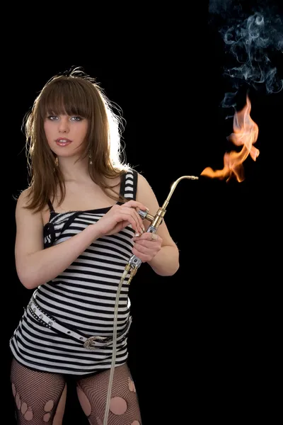 Pretty young woman with a gas torch — Stock Photo, Image
