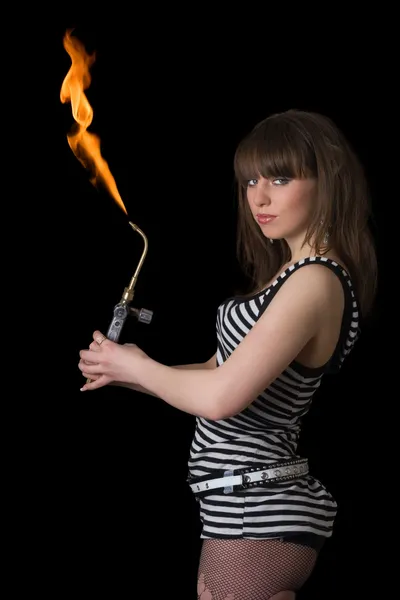 Pretty young woman with a gas torch. Iso — Stock Photo, Image