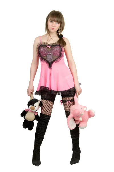 Hezká dívka v růžových šatech s plyšovými t — Stock fotografie