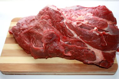 Meat on a chopping board clipart