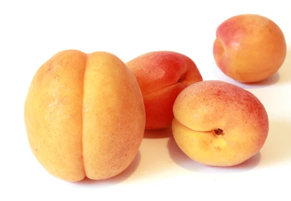 Four ripe and juicy apricot — Stock Photo, Image