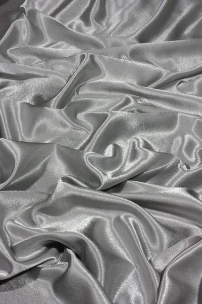 Grey silk by waves — Stock Photo, Image