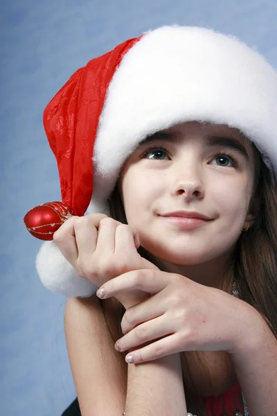 Girl is in the Christmas cap. — Stockfoto