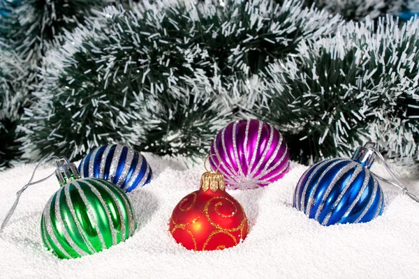 Beautiful,bright Christmas balls in snow — Stock Photo, Image