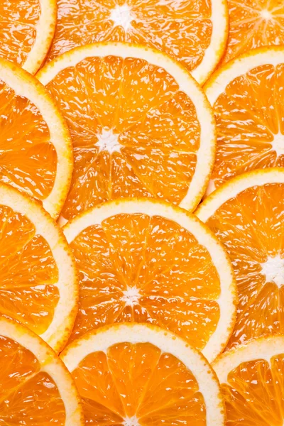 Hintergrund Teile von Orange durch Ringe. — Stockfoto