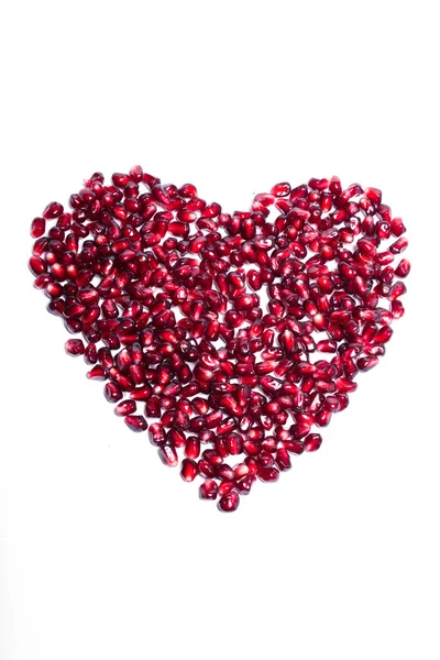 Σπέρματα ρόδι ως σημάδι καρδιά — Φωτογραφία Αρχείου