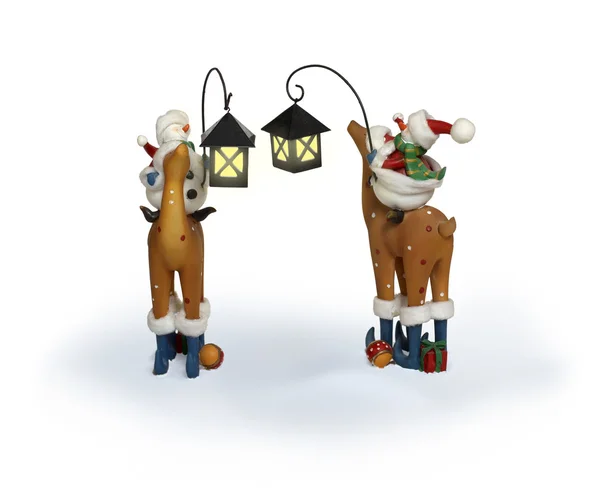 Nieuwjaar sneeuwpop paar rijden herten — Stockfoto