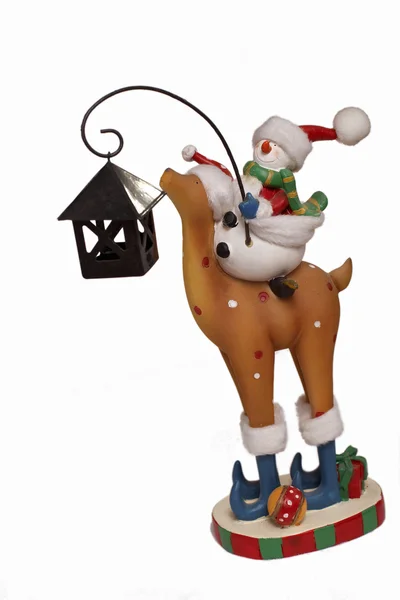 New Year snowman riding deer Stock Photo