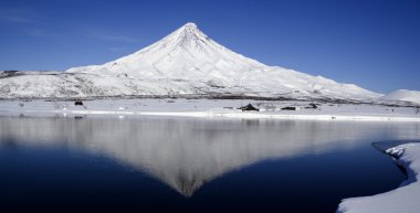 A volcano and its reflexion clipart