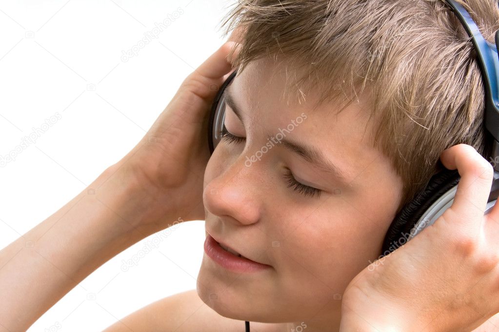 The boy listens to music