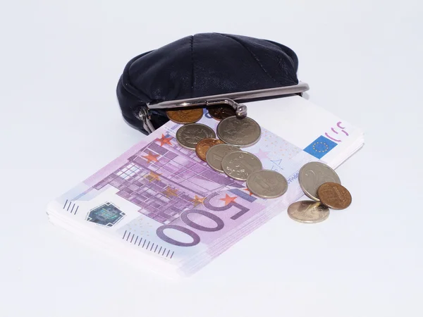 Bolsa com pacotes de moeda em um bac branco — Fotografia de Stock