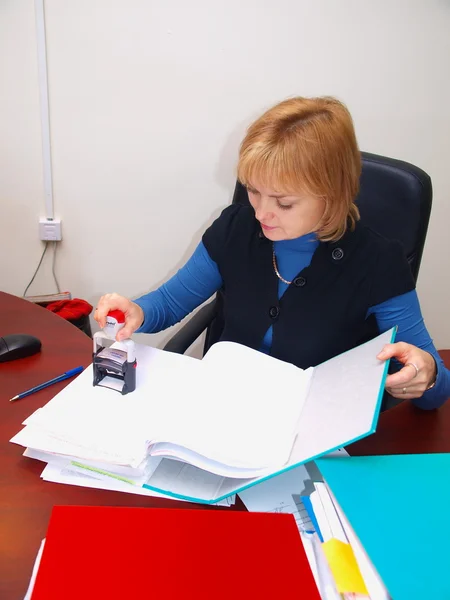 stock image The bookkeeper works with documents