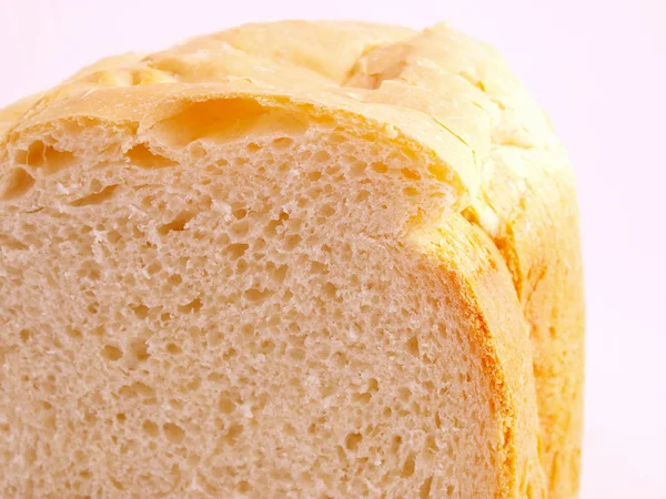 Řez chleba na bílém pozadí — Stock fotografie