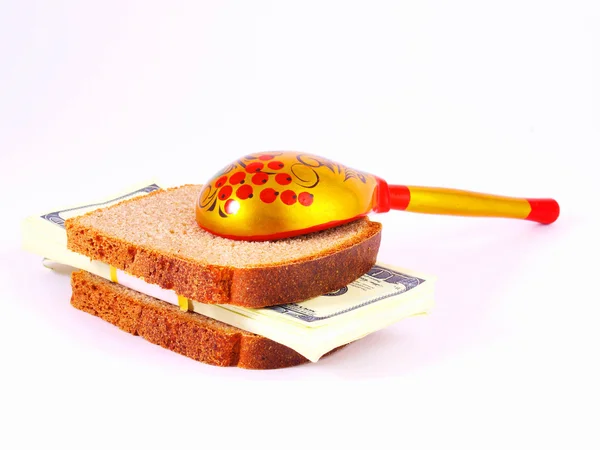 Bread, money and spoon on a white — Stock Photo, Image