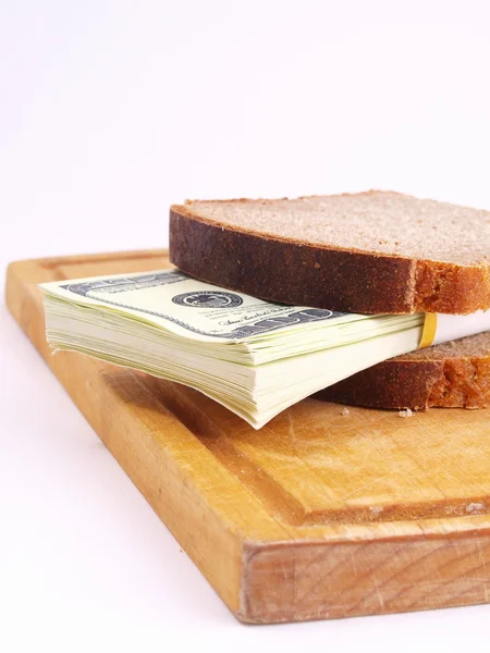 Monetära smörgås på en vit bakgrund — Stockfoto