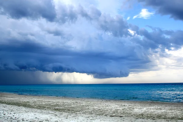 stock image Stormy weather with rain on the beach